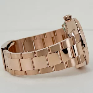 rolex-everose-gold-sky-dweller-watch-fluted-ring-command-bezel-blue-green-index-dial-oyster-bracelet-235584_1024x1024@2x